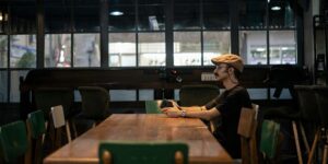 a lone person sitting at a table