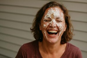 woman with pie all over her face