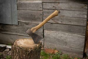an axe planted in a stump