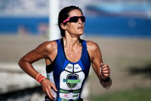 “A runner giving their full effort, straining toward the finish line, symbolizing persistence beyond ‘trying your best.’”