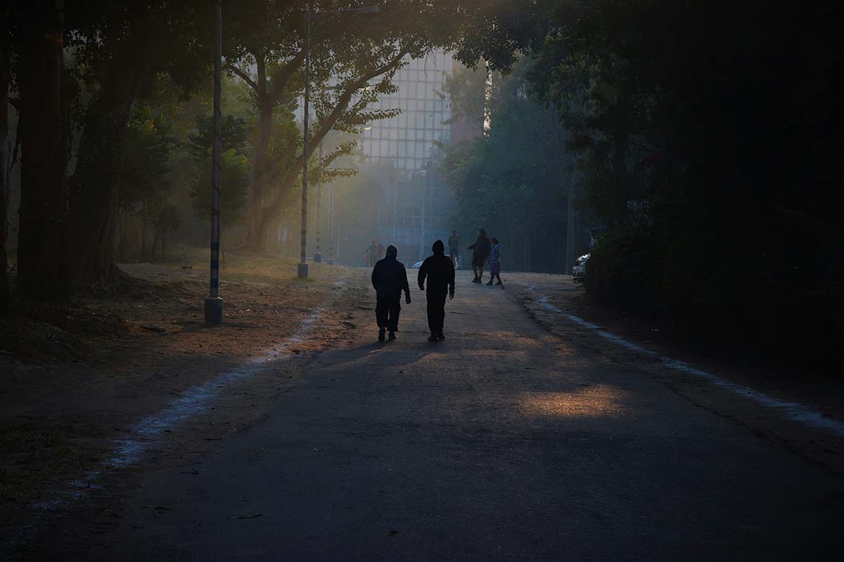 two-walking - Low Two Pair Two people walking together, supporting one another through a quiet moment.