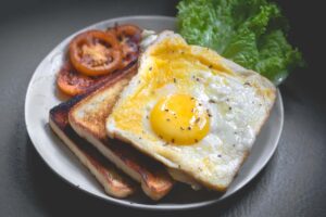 breakfast08a0873cd71141d7807a8a7dd4394516 - Low Two Pair eggs, toast on a breakfast plaste